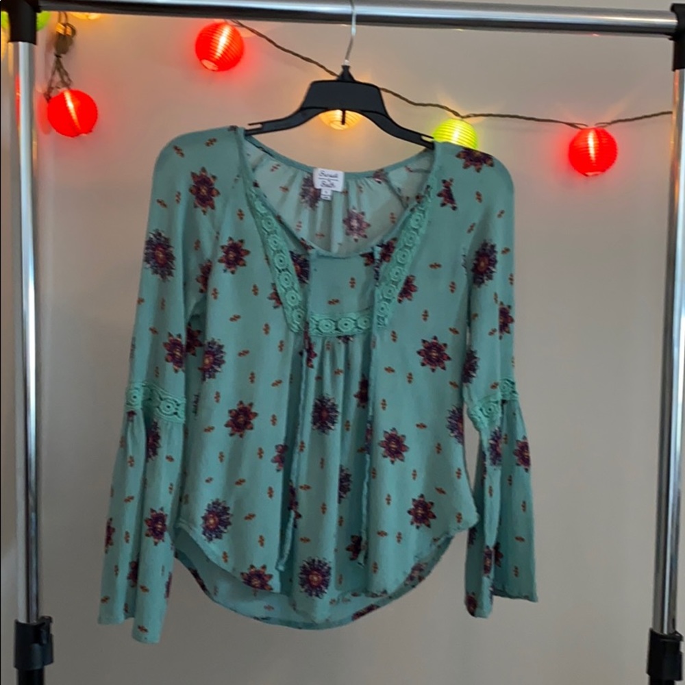 A long green sleeve shirt.